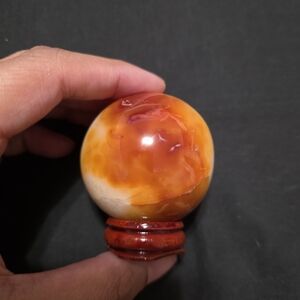 Orange Carnelian Agate Sphere on Wooden Stand